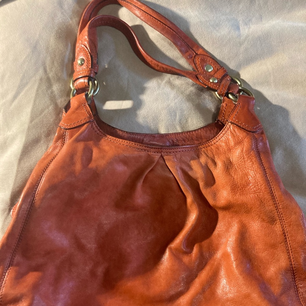 Orange leather Coach Tote bag with cloth cover
